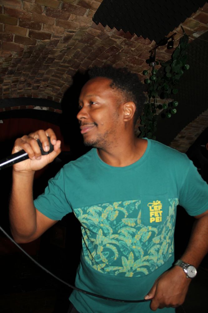 Karaoke host with a microphone
